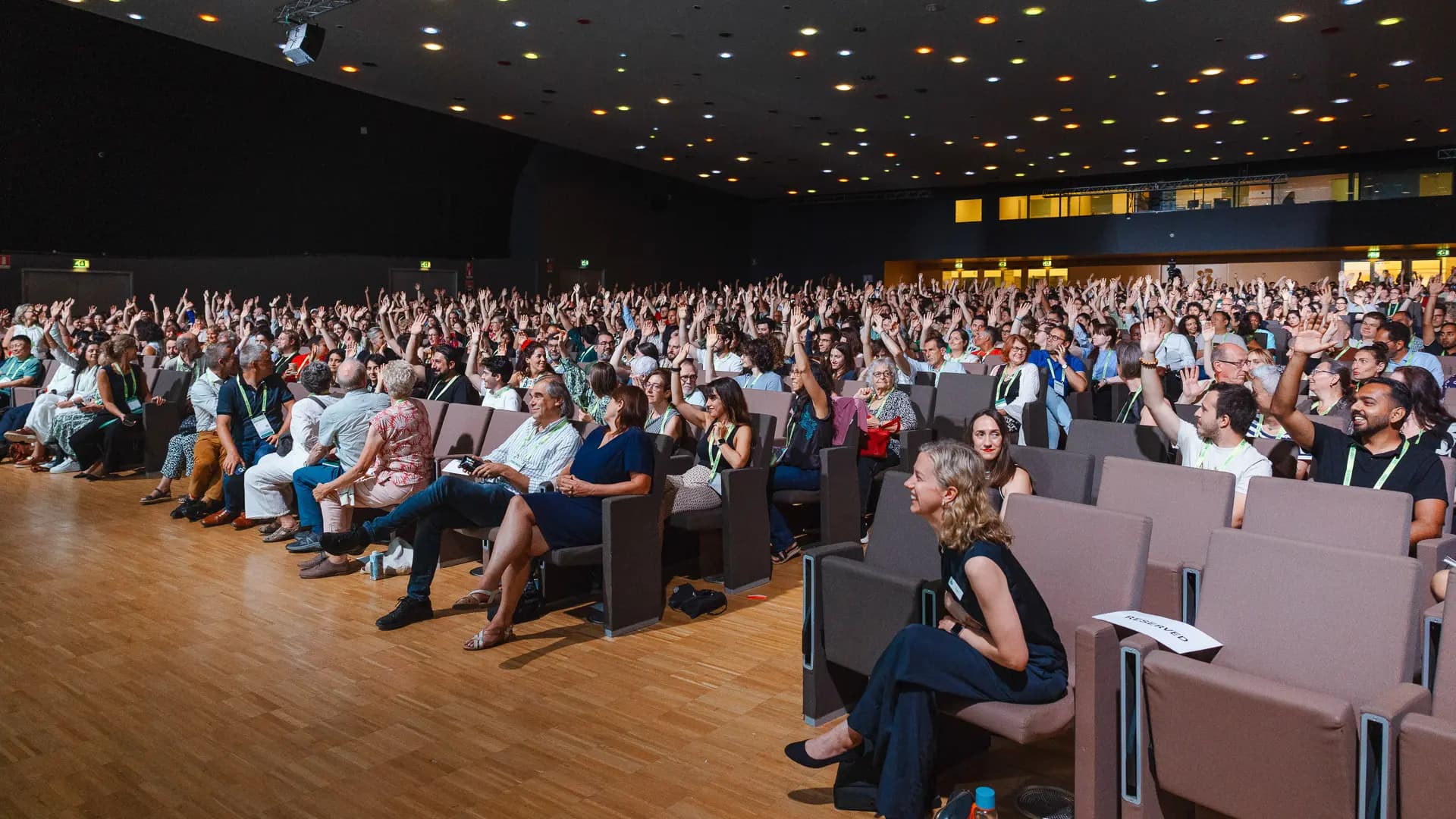 Conference photography — large auditorium with engaged audience